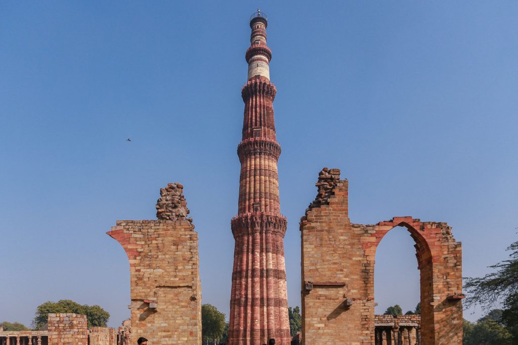 The Qutub Minar and the ruins of monuments surrounding it. 